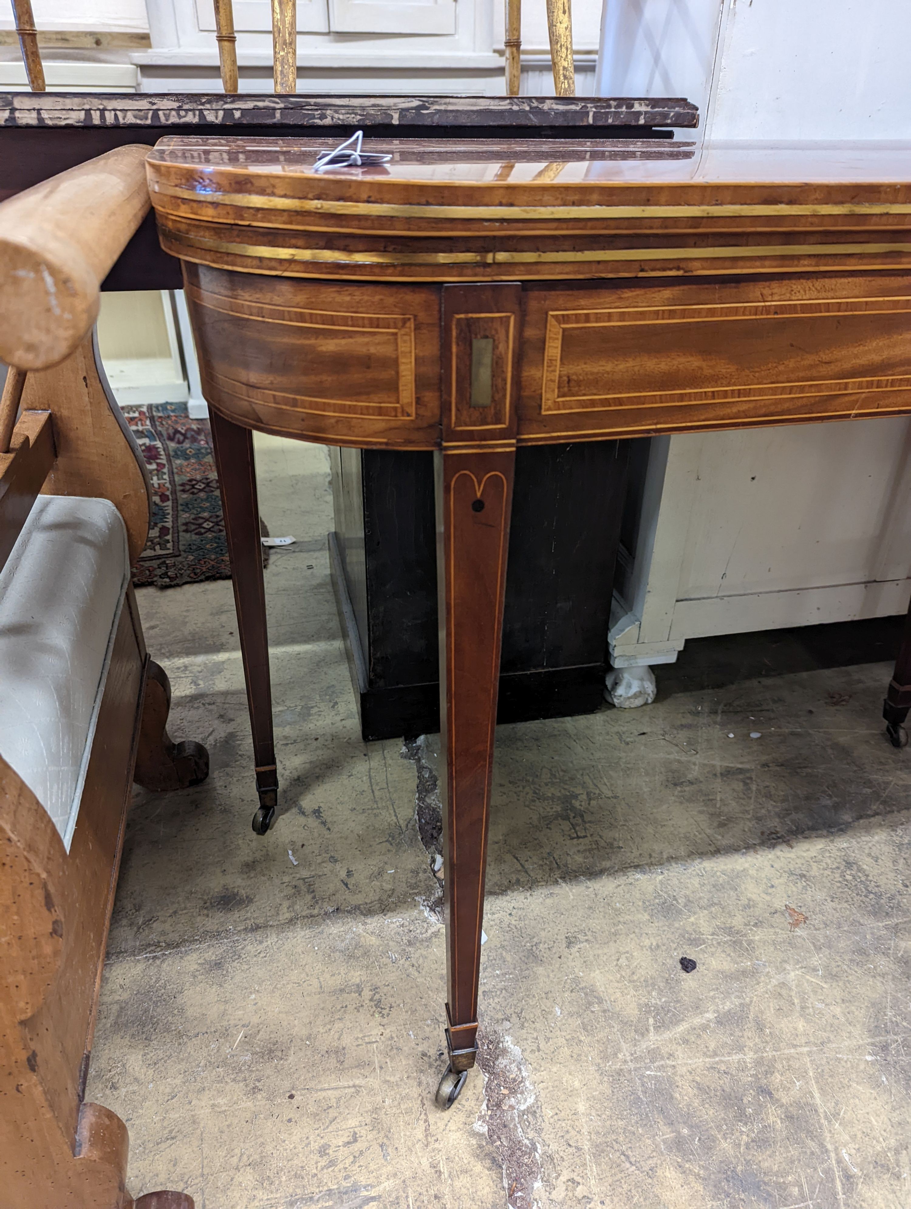 A Regency banded mahogany D shaped folding card table, width 90cm, depth 44cm, height 75cm